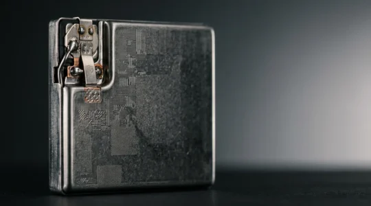 Close-up photograph showing the internal components of a modern smartphone battery in pristine condition