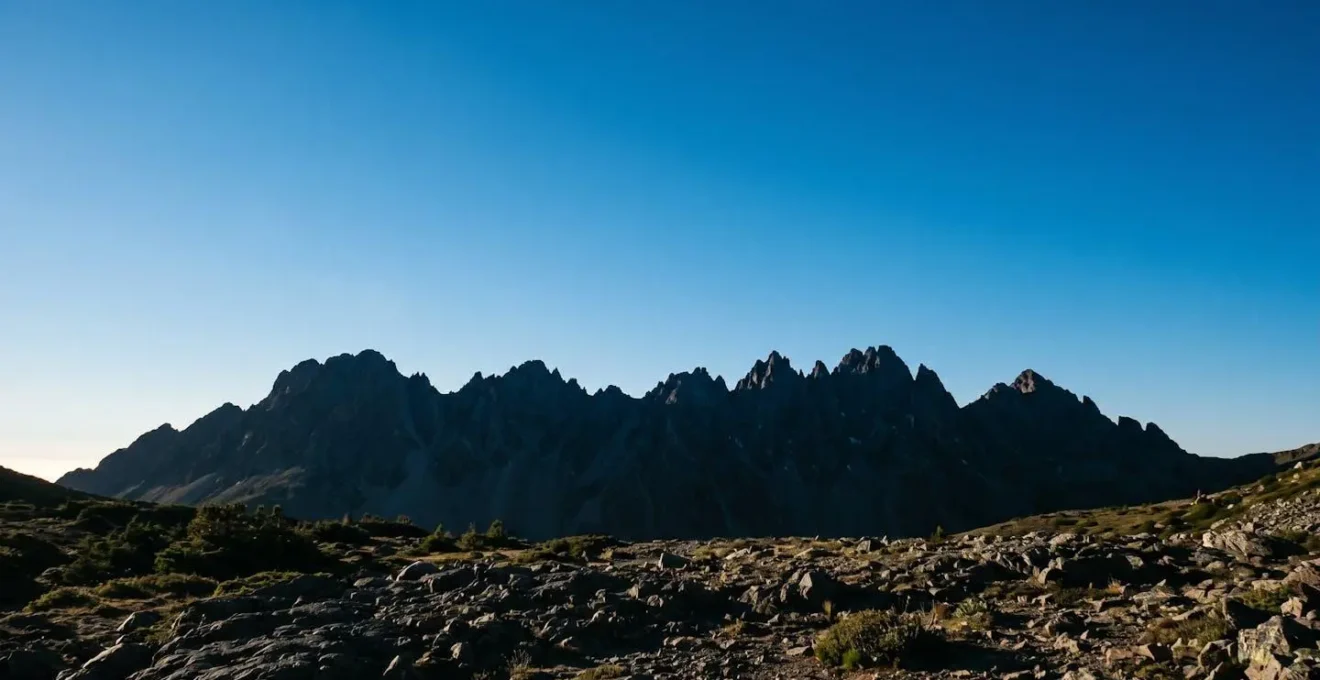 High-contrast mountain landscape showing artificial halo effect created by aggressive AI sky processing
