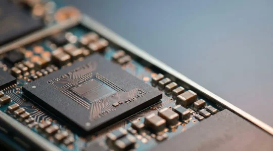 Close-up view of smartphone internal components showing system-on-chip architecture and integrated circuit board